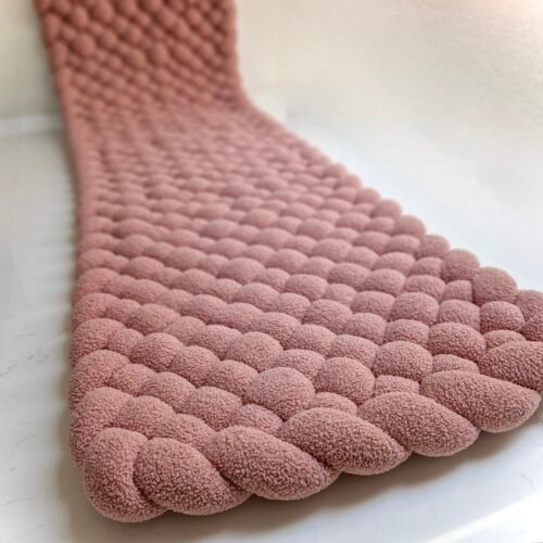 Tapis tresse rose